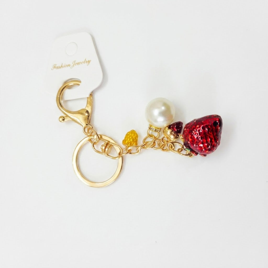 Crystal-embellished fruit charms.